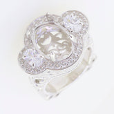 Elegant silver ring with intricate design and sparkling gemstones, perfect for sophisticated jewelry collections.